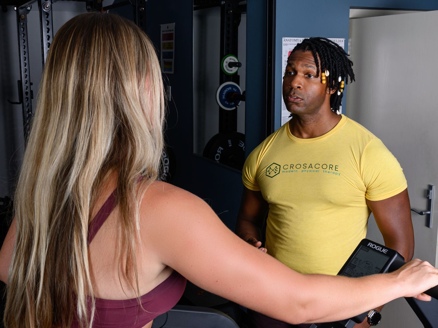 Brandon listening closely to a client during a conversation in the clinic